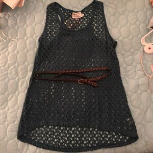 Crochet sleeveless top with belt.